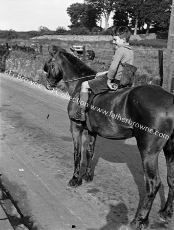 BOY ON HORSEBACK